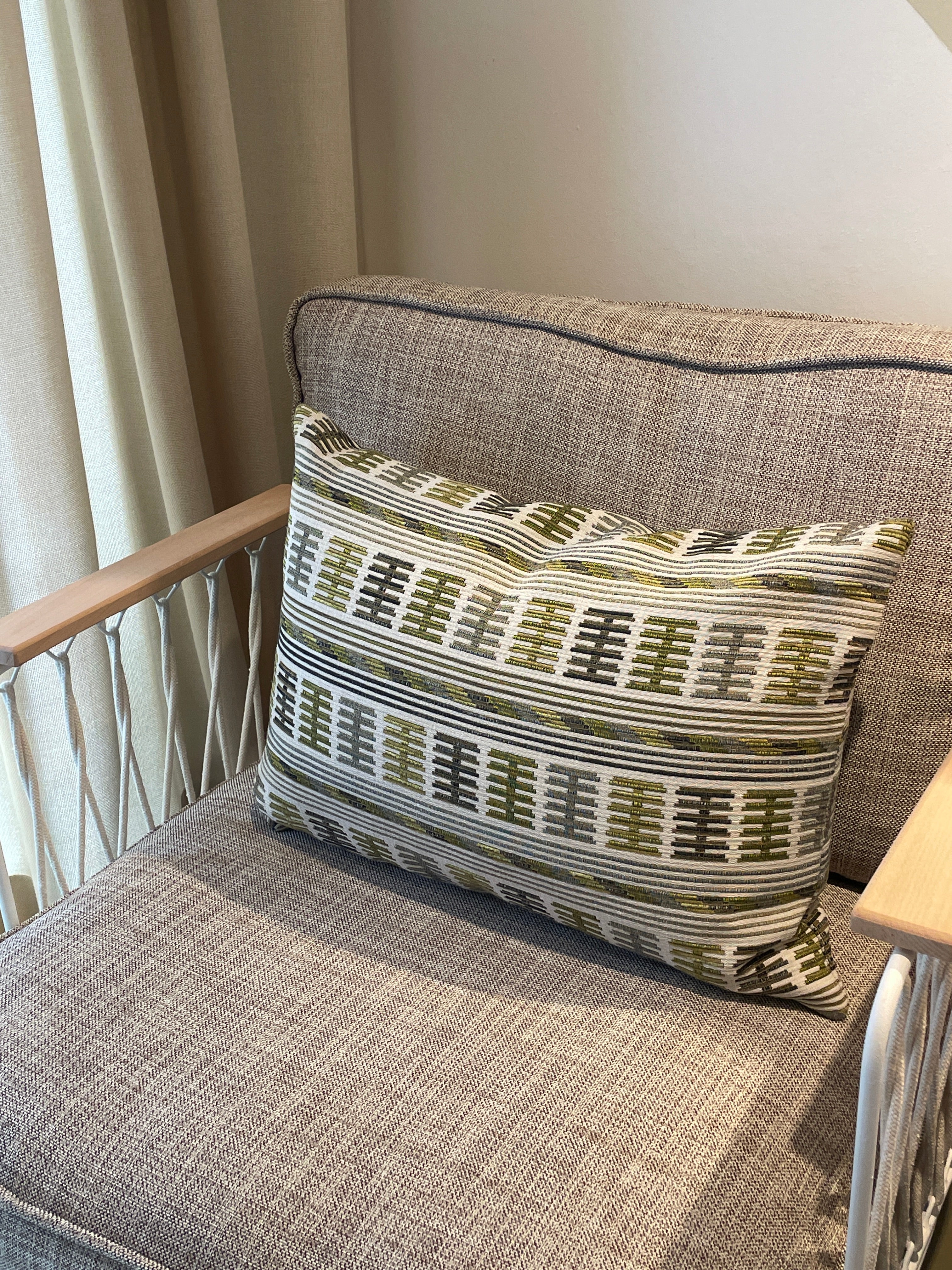 Embroidered cushion in shades of green