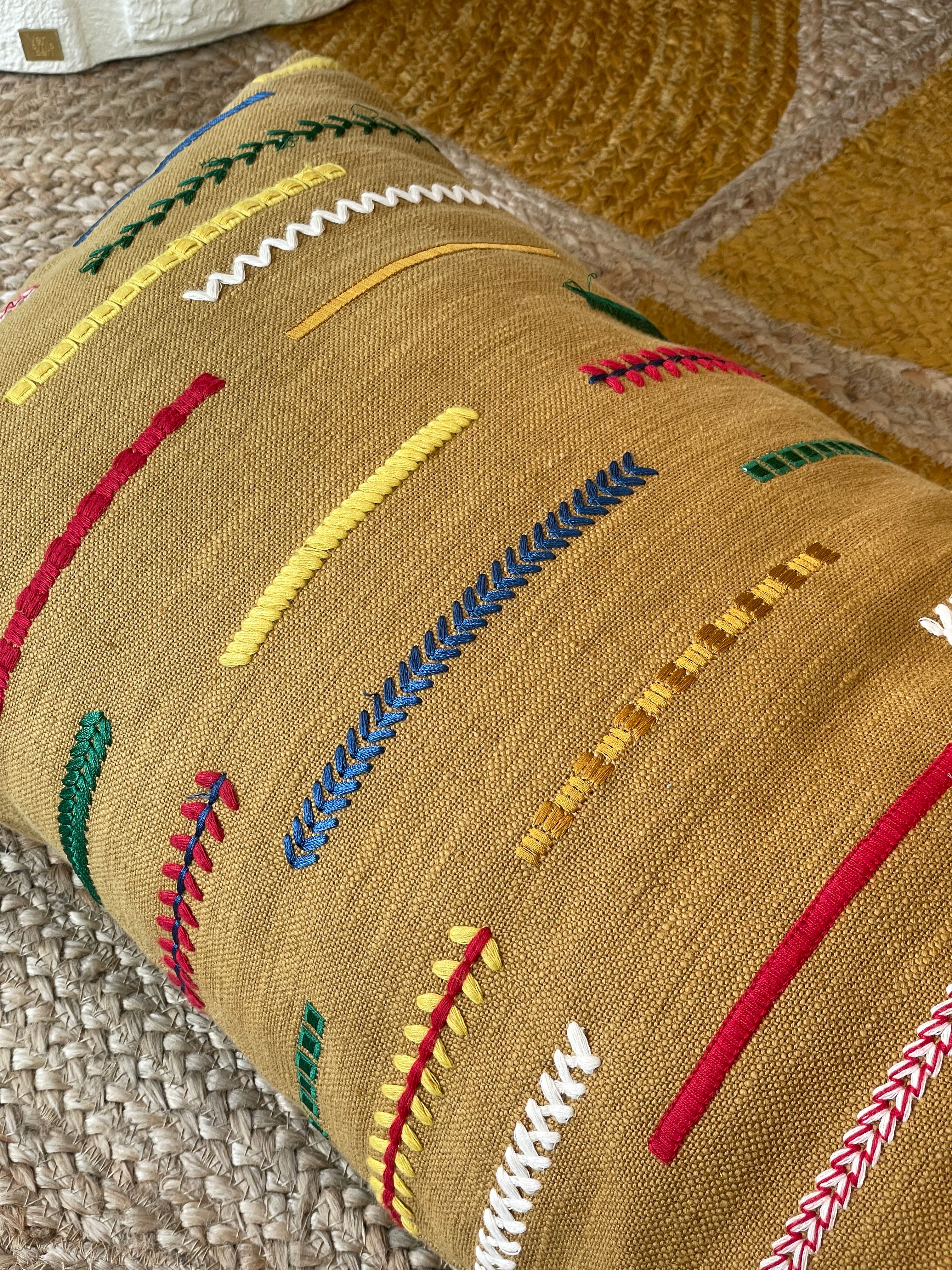 Embroidered cushion in ethnic style