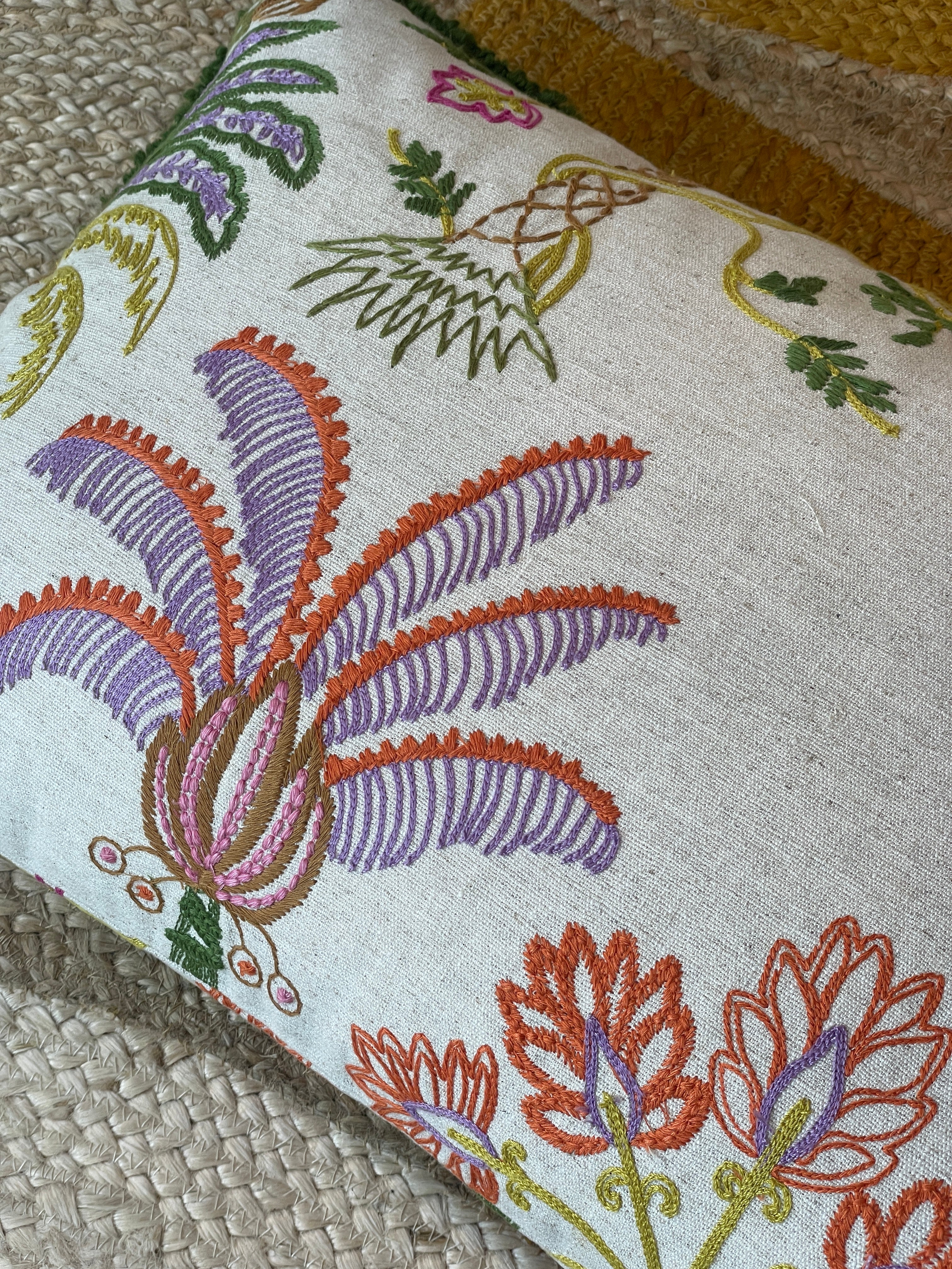 Hand-embroidered cushions with palm motifs