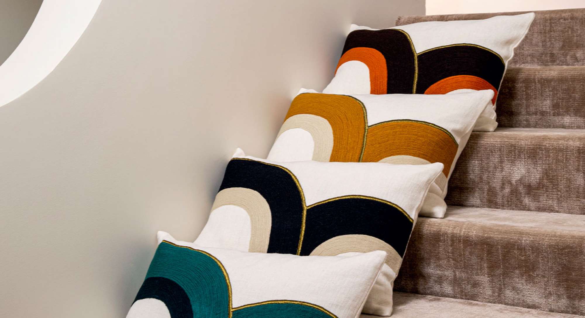 Embroidered cushion by Élitis in three colors