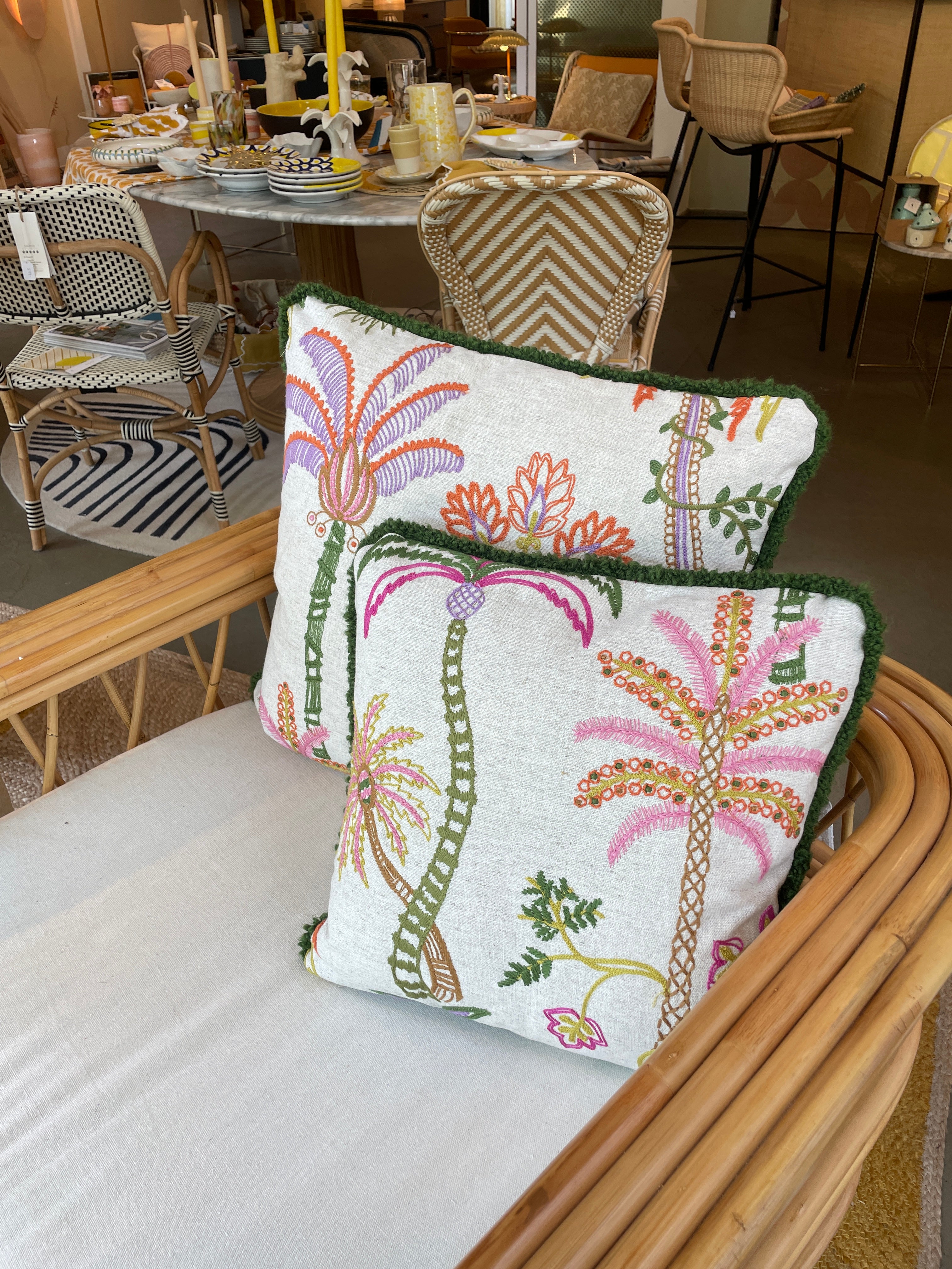 Hand-embroidered cushions with palm motifs