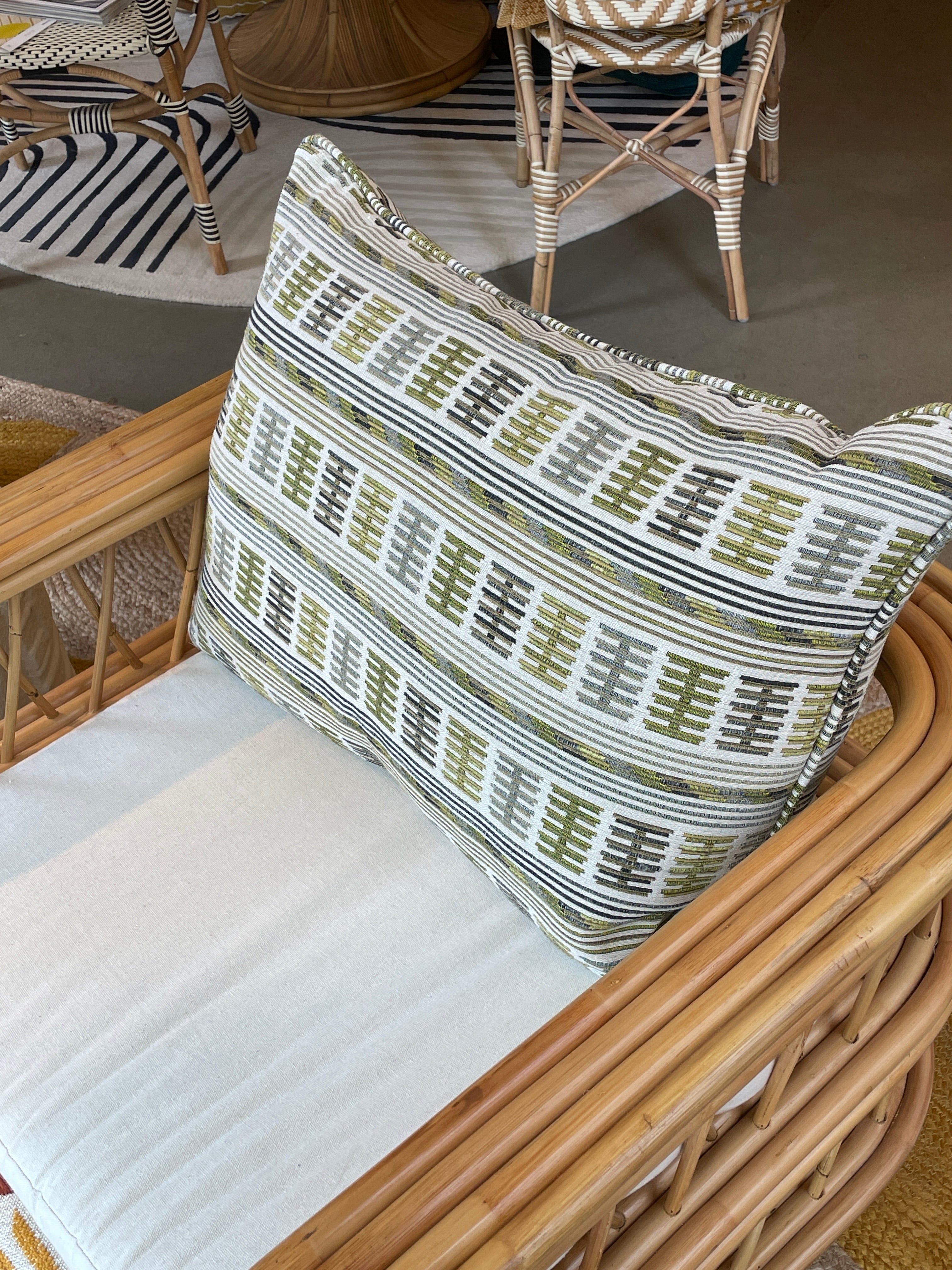Embroidered cushion in shades of green
