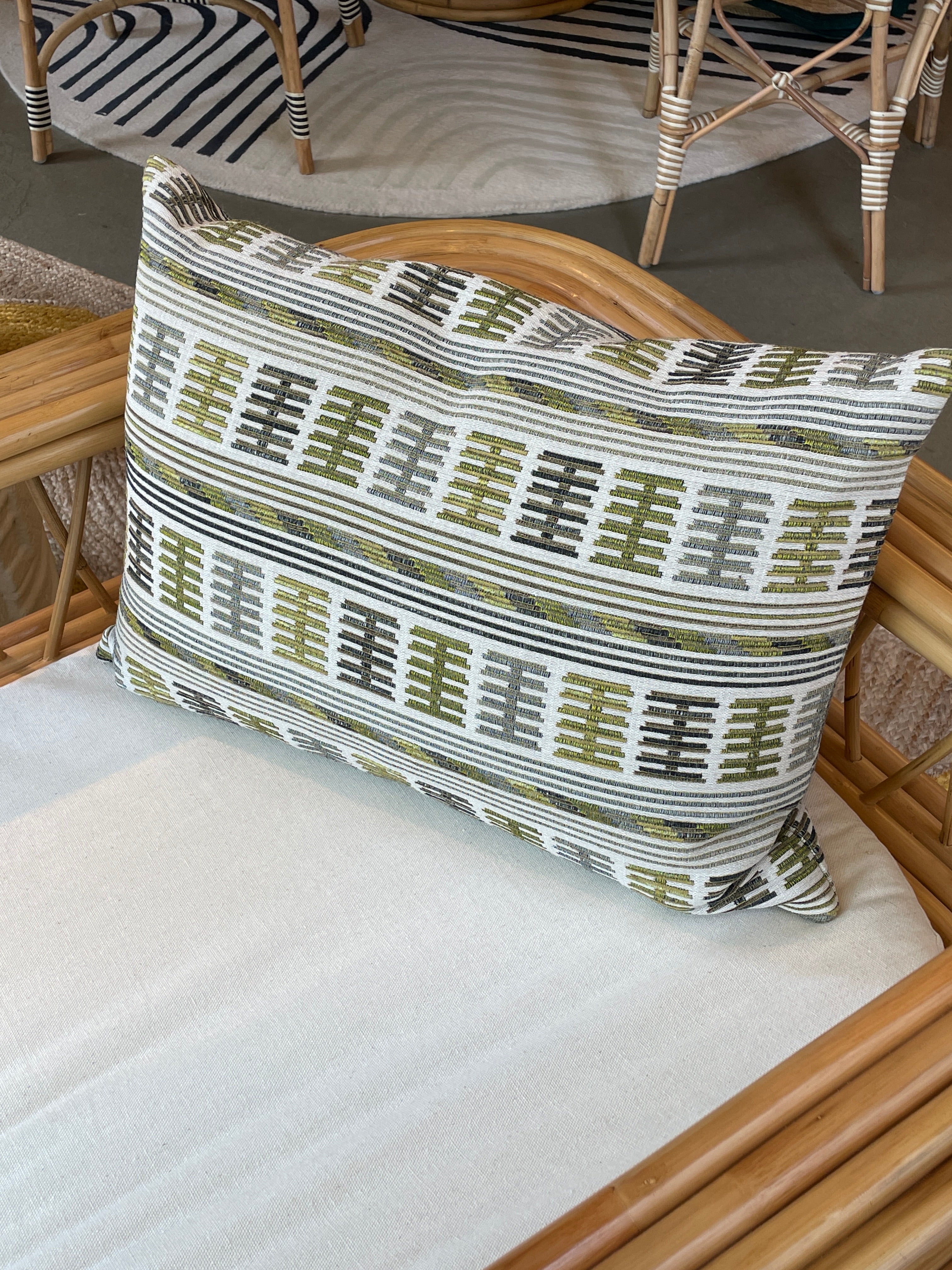 Embroidered cushion in shades of green