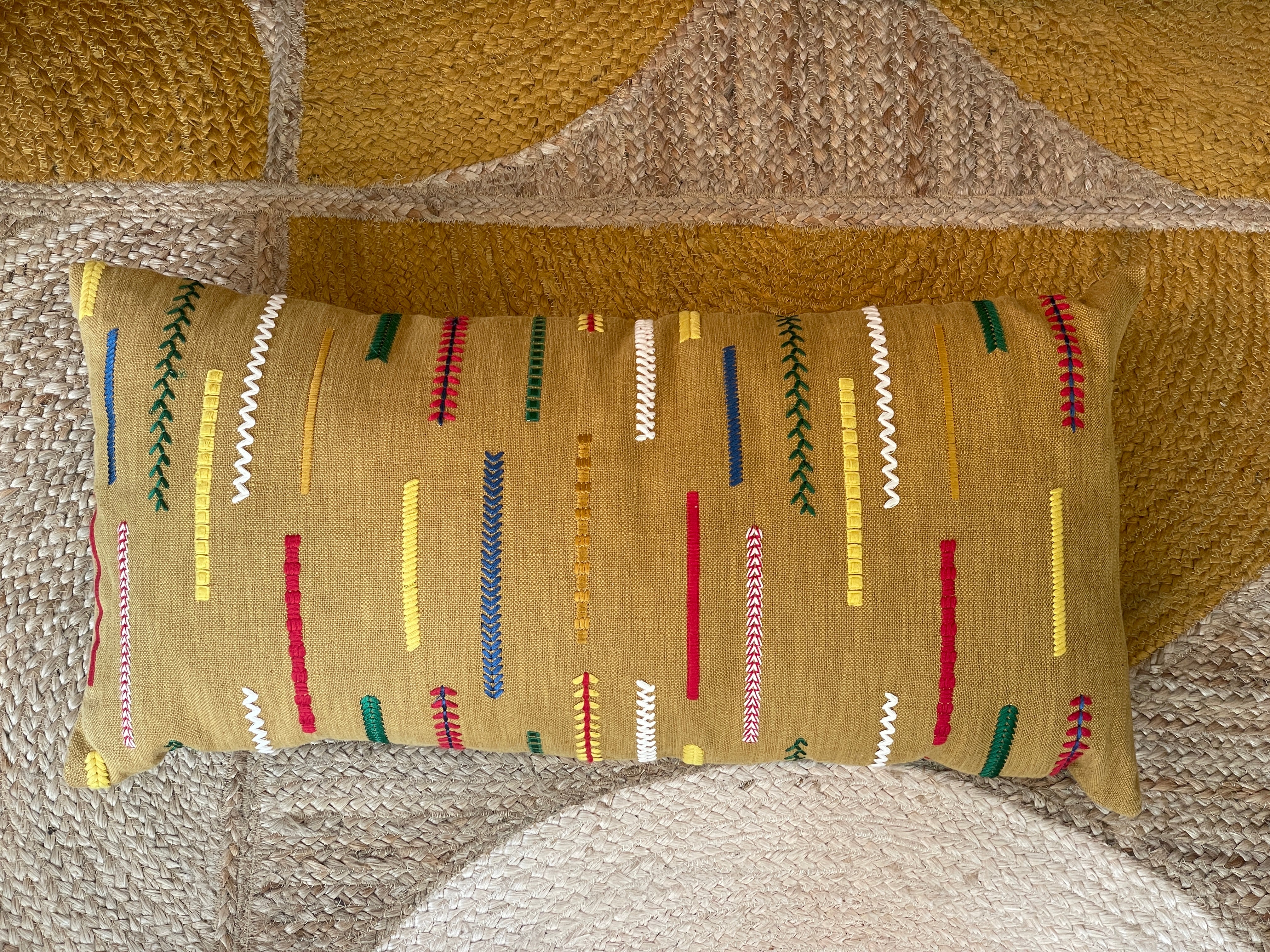 Embroidered cushion in ethnic style