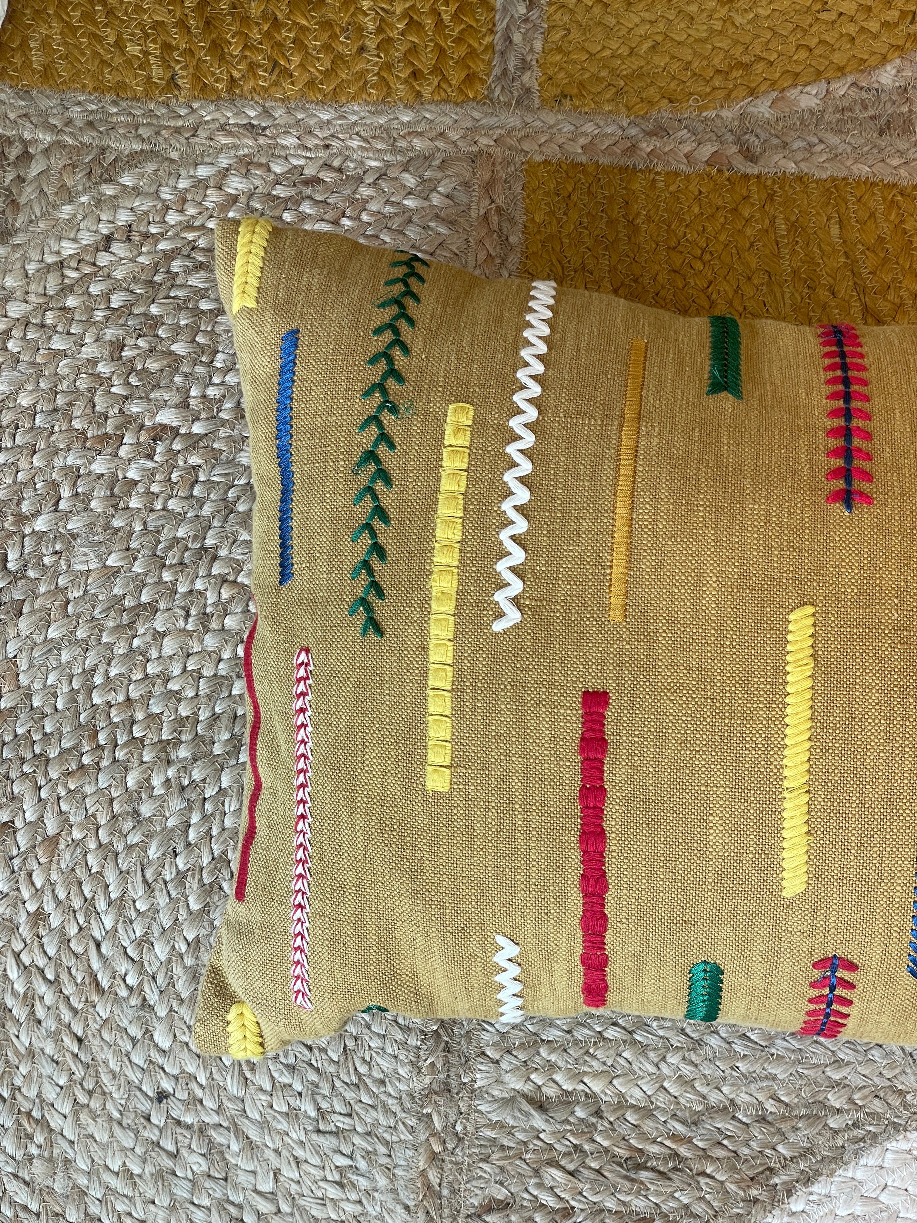 Embroidered cushion in ethnic style