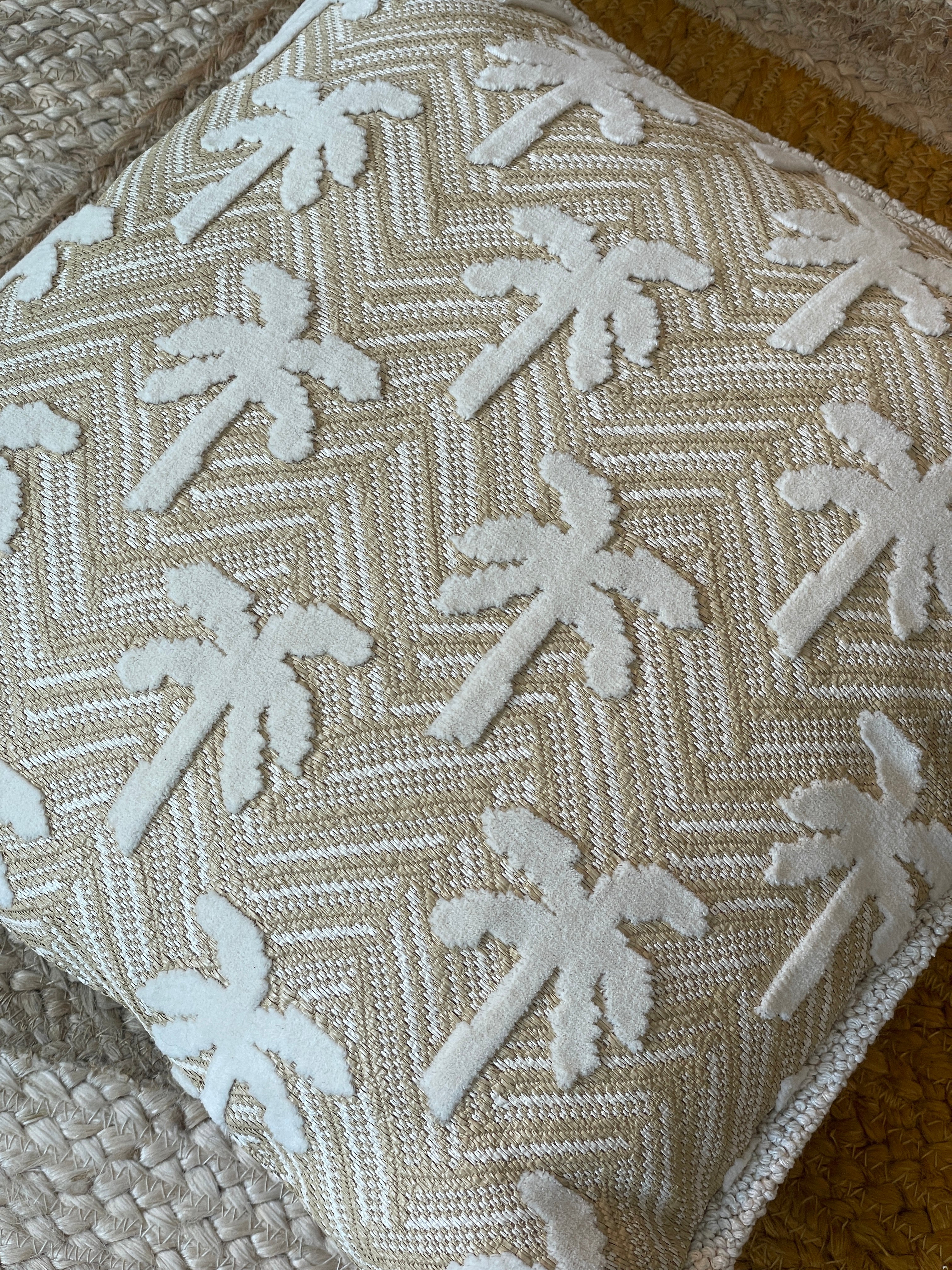 Cushion made of outdoor fabric with palm trees